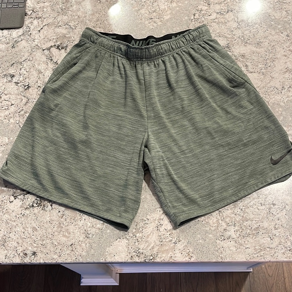 green nike shorts